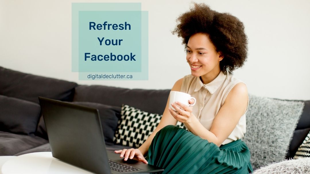 Girl smiling, sitting on a couch with a drink in a mug looking at her laptop while she declutters her Facebook account.
